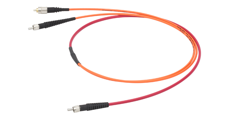 Bifurcated Fiber Bundle with an SMA Connector and Red Tubing on the Common End, and One SMA Connector, One FC/PC Connector, and Orange Tubing on the Split ends.