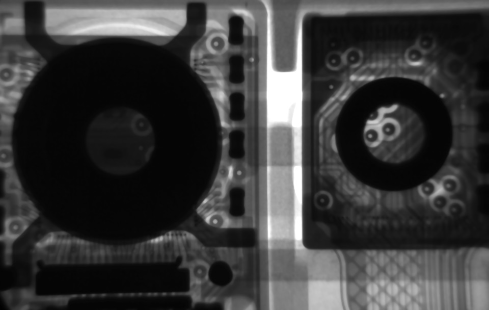 X-ray image of a commercial smartphone, showing the camera and position detector.