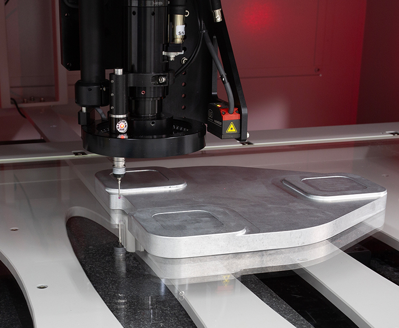 A VideoMic system with a touch probe, measuring a part.