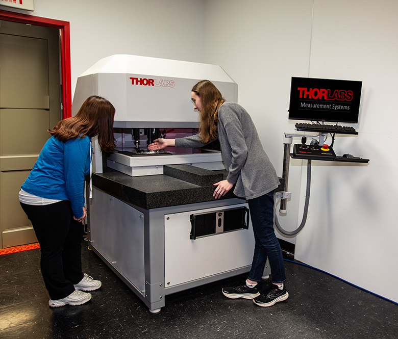 Two Thorlabs' employees working in our demo room.