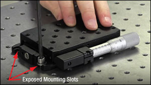 Using a mounting slot to secure a linear translation stage to an optical table or breadboard.